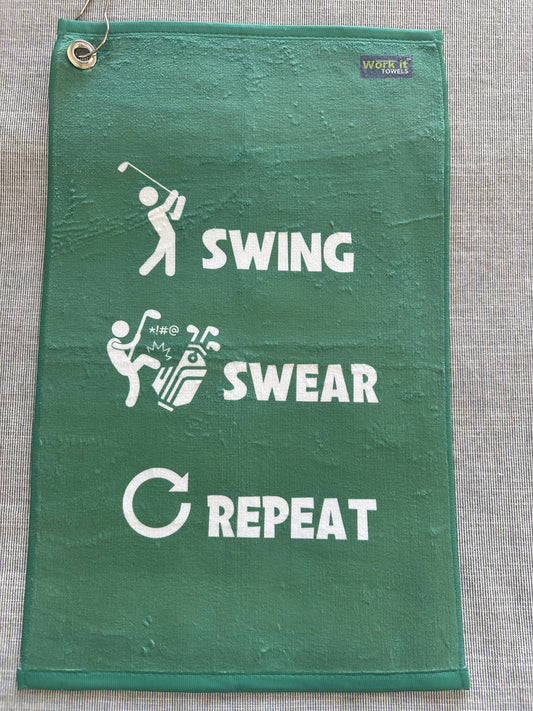 green golf towel with 'swing swear repeat' text and coordinating graphics (golf swinger, kicking clubs, arrow) in white font. Includes hook and grommet.