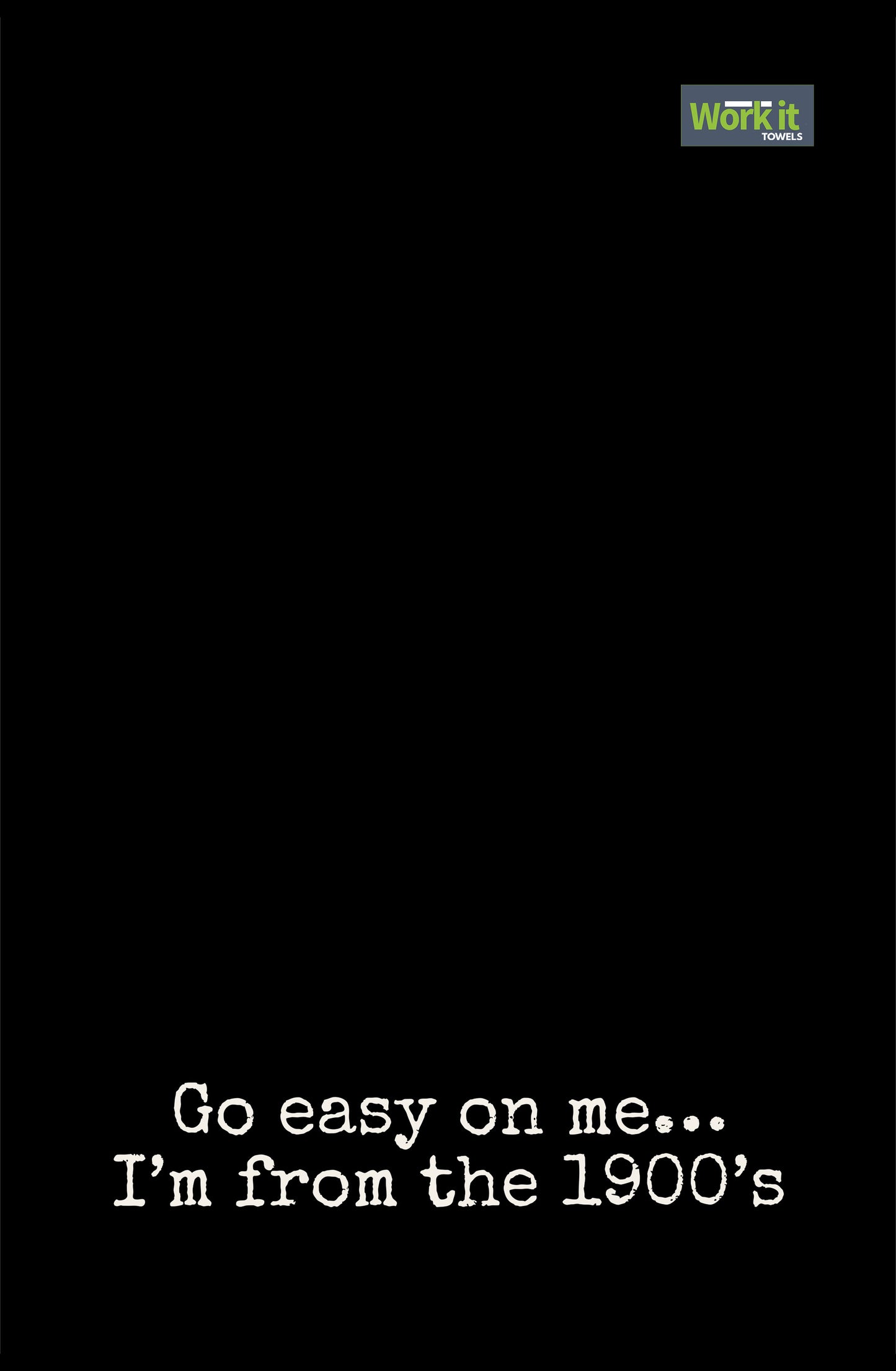 Black towel design with white text 'Go easy on me... I'm from the 1900's' and a green logo at the top right corner.