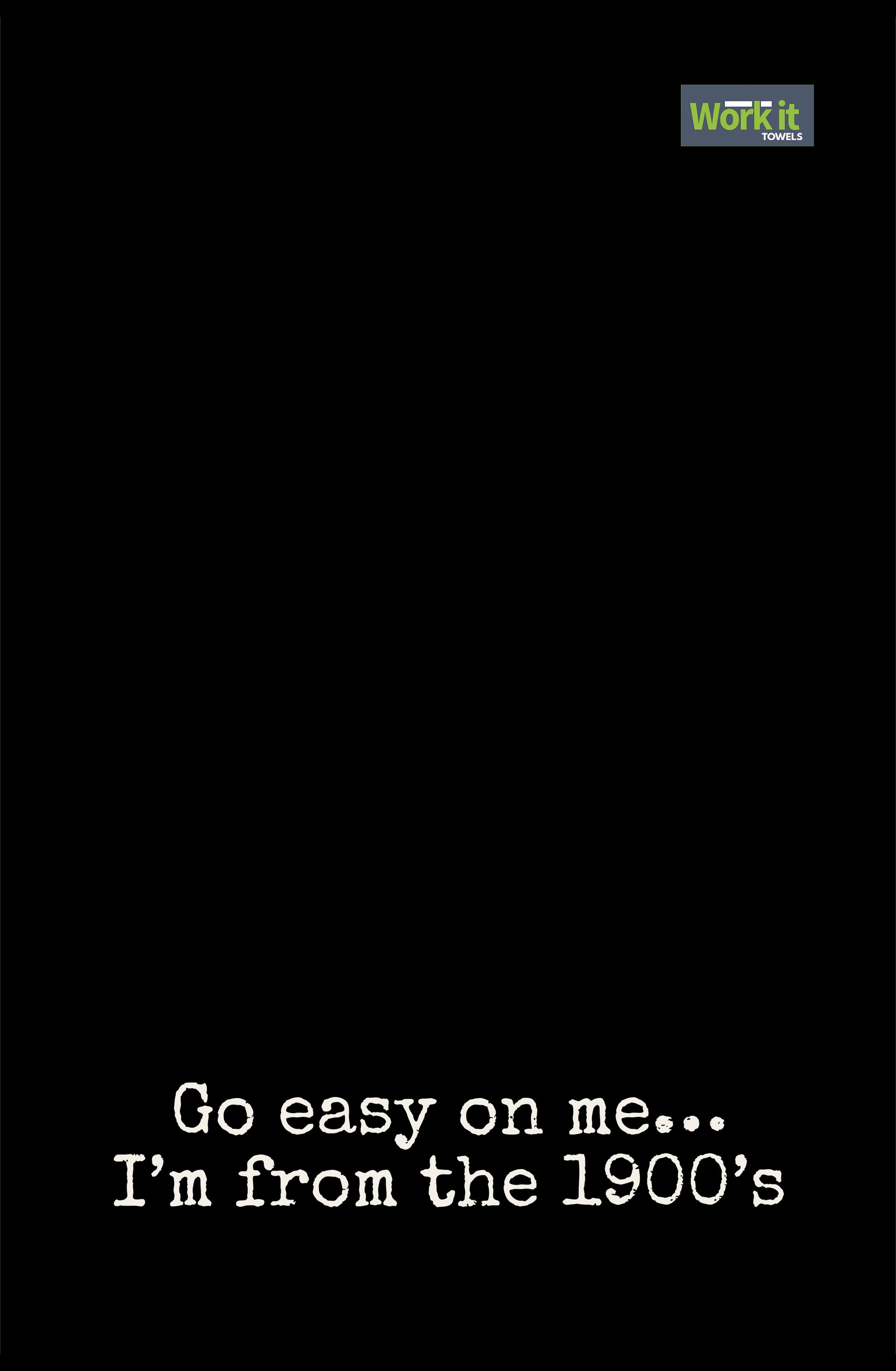 Black towel design with white text 'Go easy on me... I'm from the 1900's' and a green logo at the top right corner.
