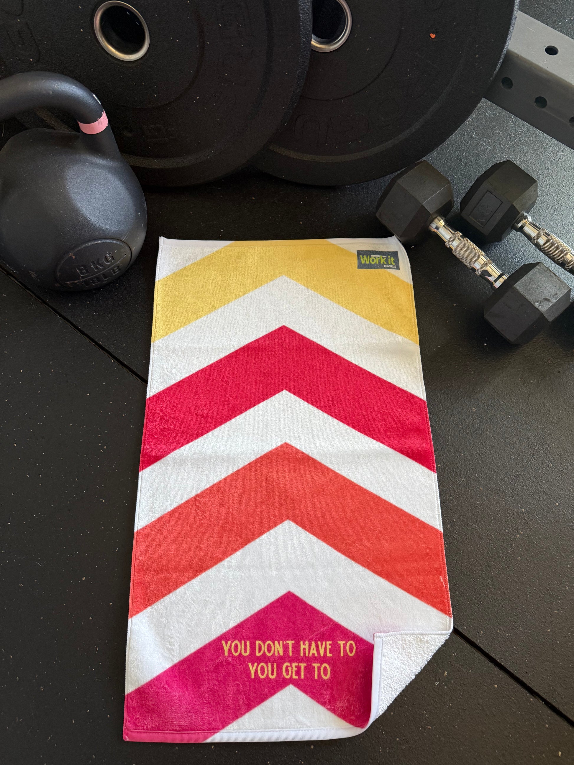 Chevron patterned pouch on a gym floor with weights in the background