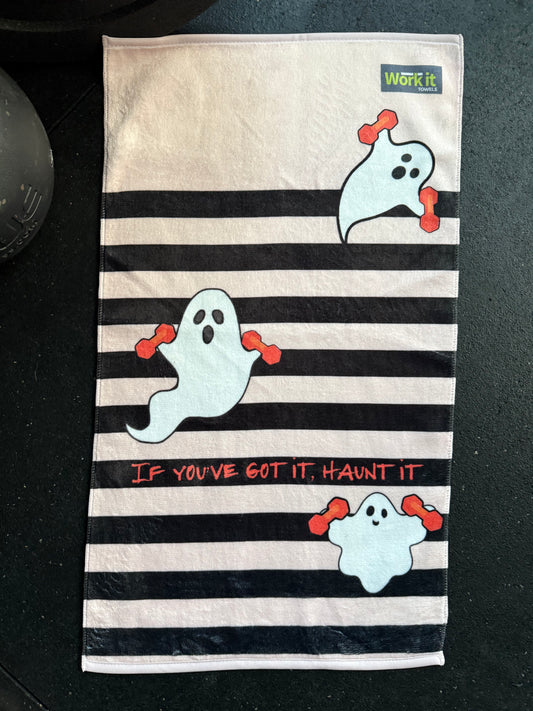 gym towel with ghost designs and text on a black and pink background