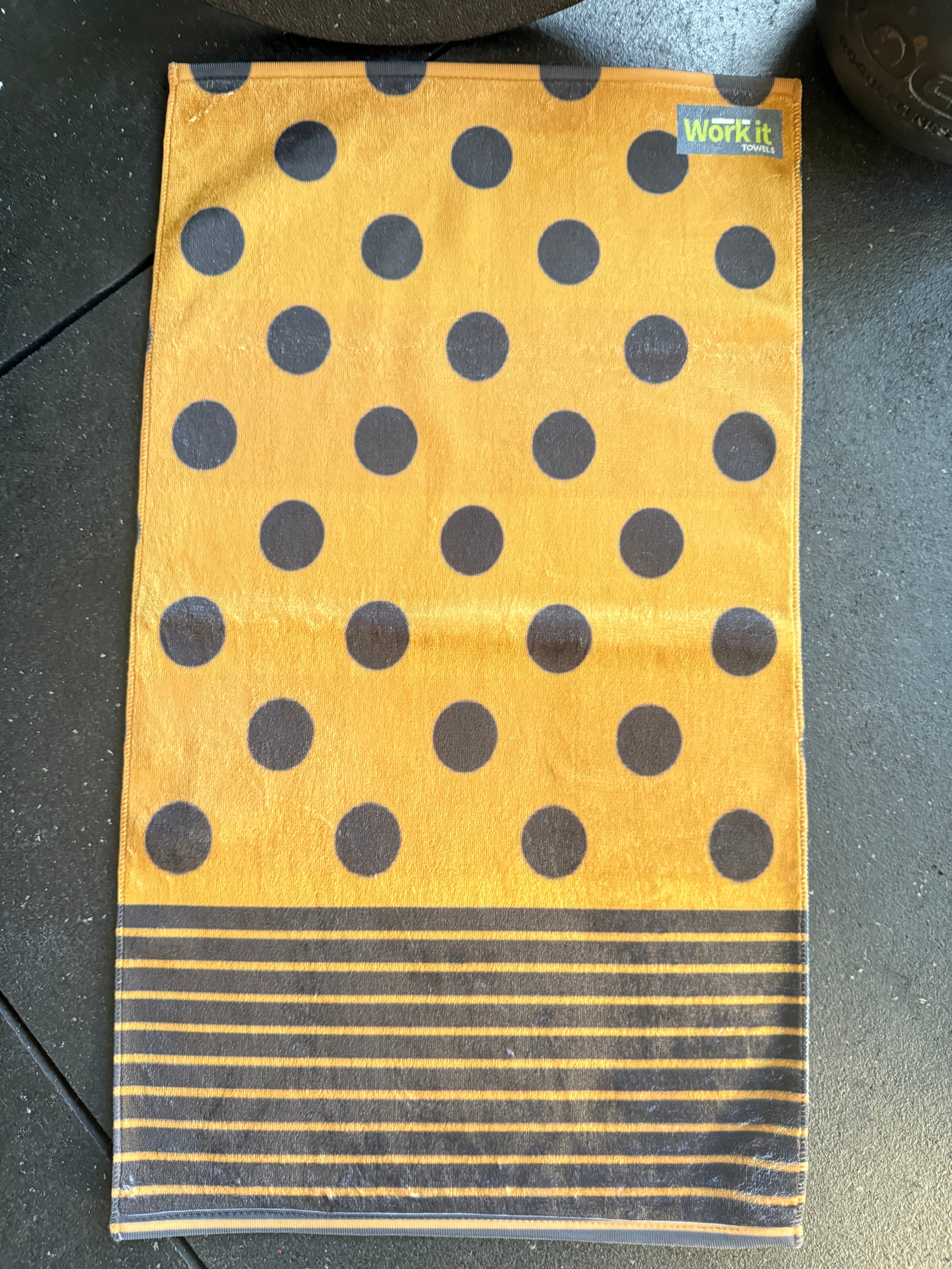 Towel with polka dot pattern on a dark surface