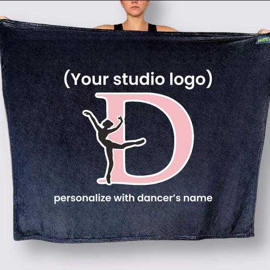 Black blanket with a pink 'D' and dancer silhouette, customizable with studio logo and dancer's name.